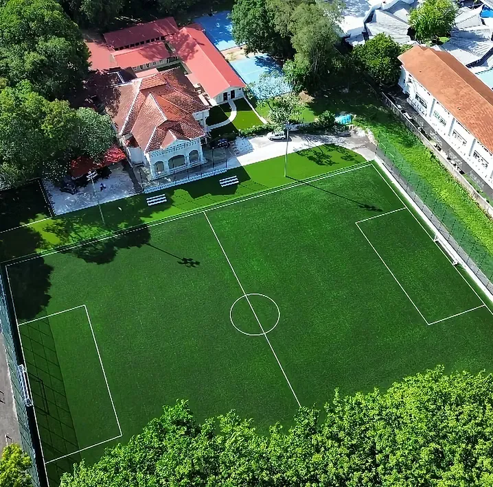 Aerial view of Soccer Experience Georgetown from the corner, with the pitch alongside the heritage clubhouse on Jalan Macalister