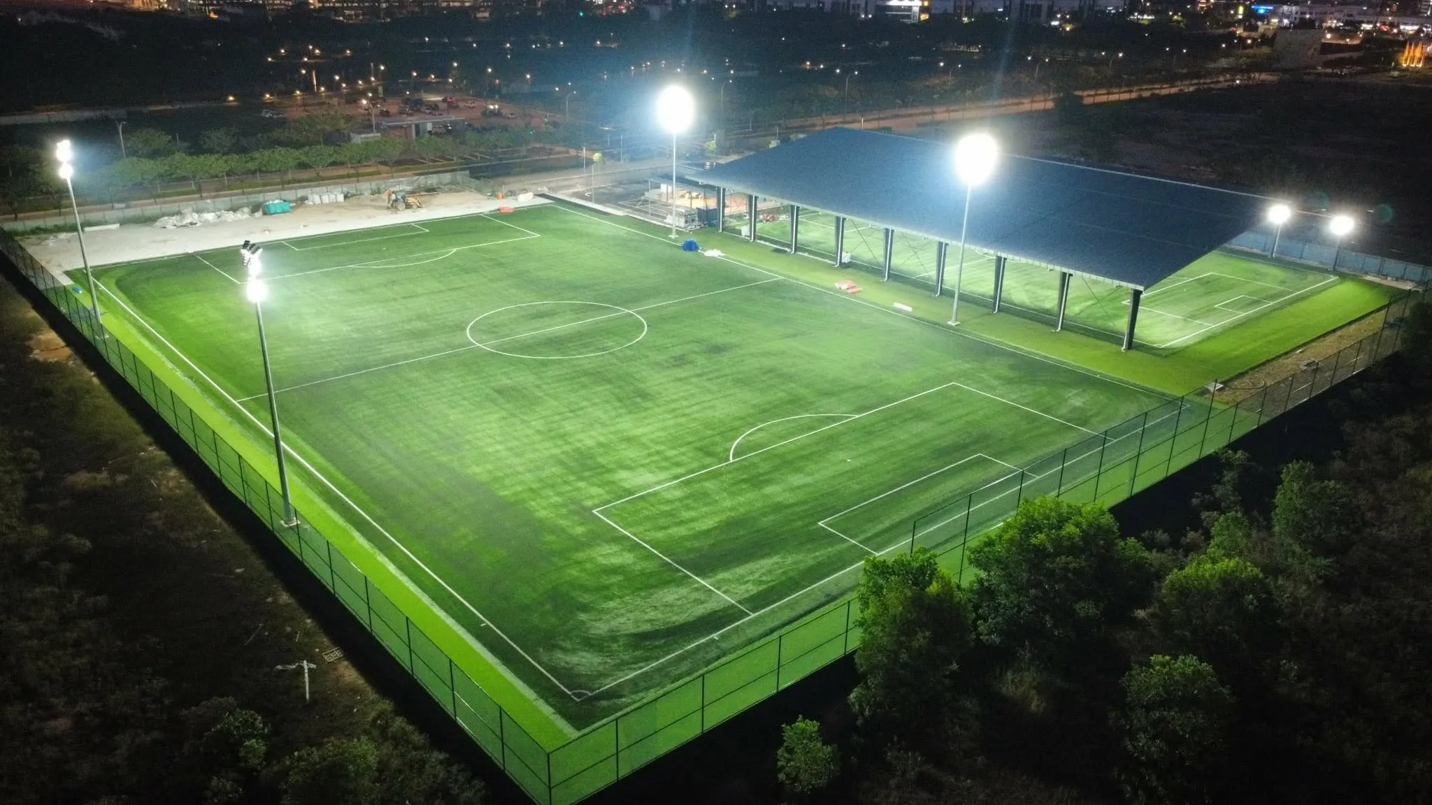 A floodlit night match under way on a FIFA-quality pitch at Soccer Experience in Penang