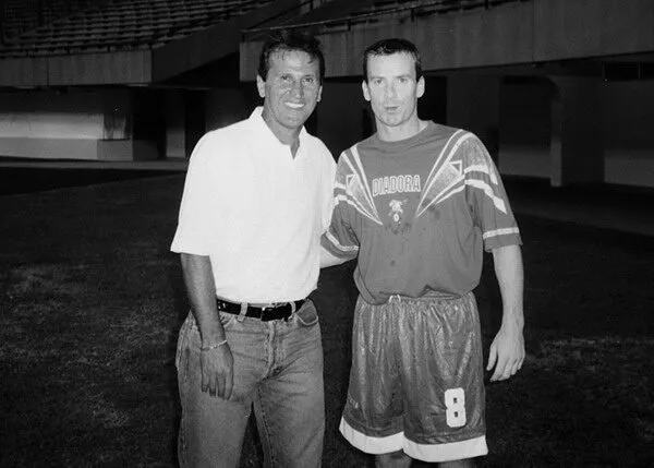 Martin Tierney in his playing days, photographed with Brazilian football legend Zico