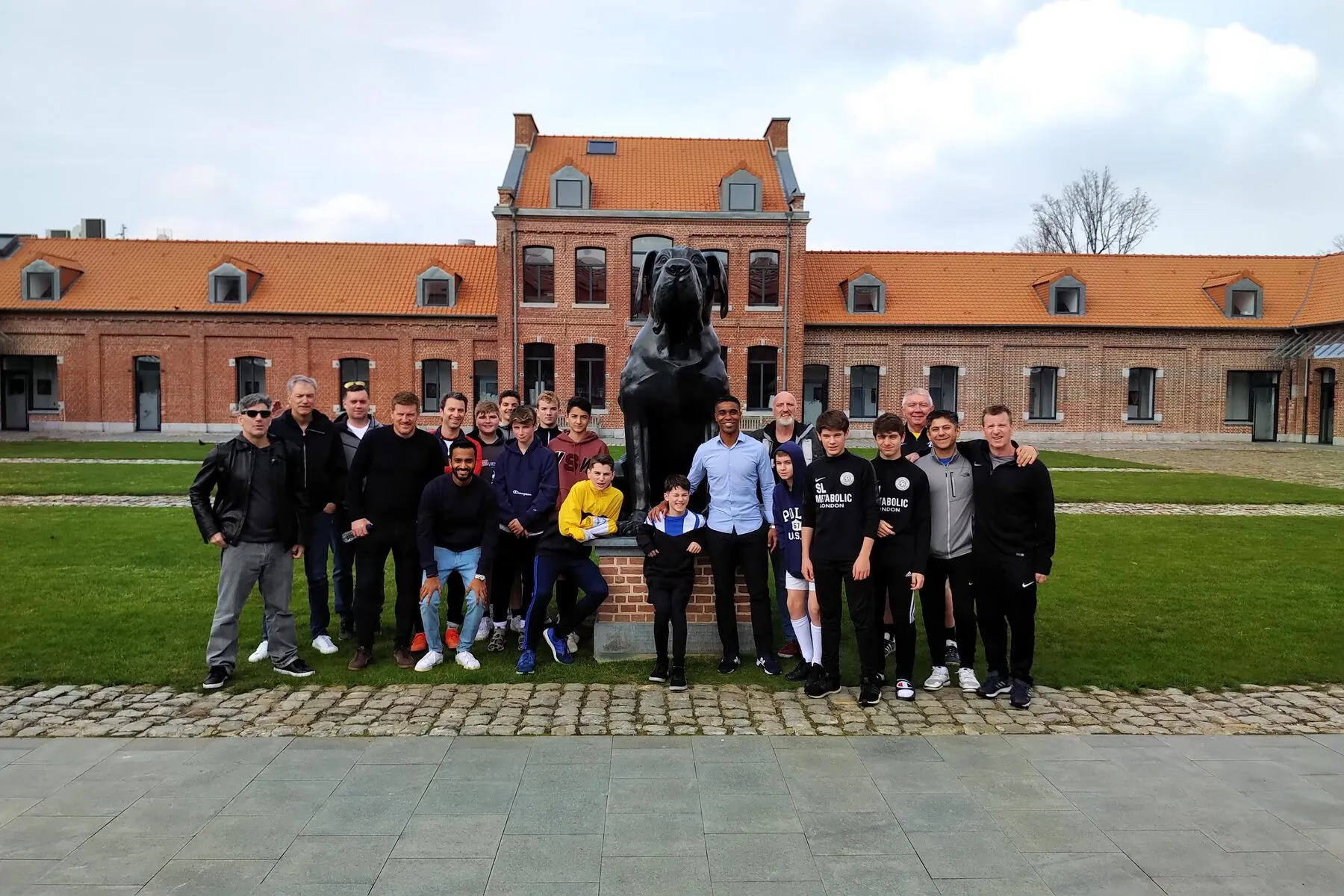 A touring group photographed outside the chateau at OSC Lille’s academy in France