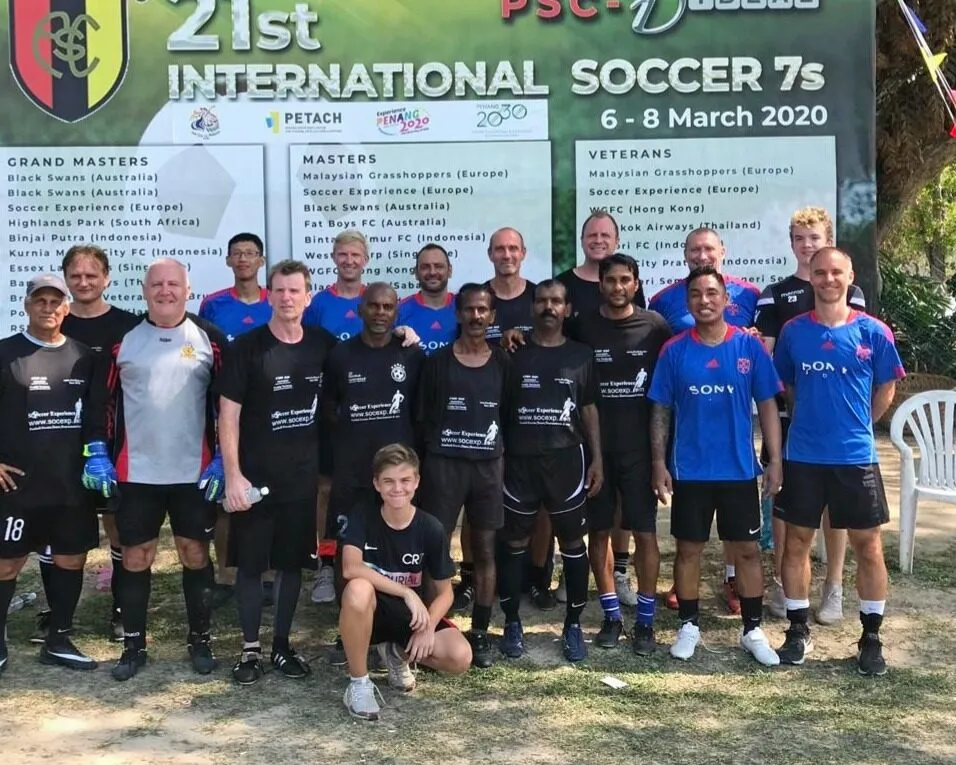 Veterans players gathered in front of the tournament board at the 21st International Soccer 7s in March 2020